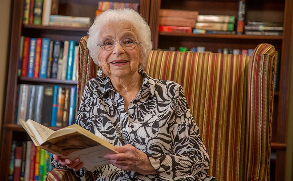 The library at Scholl Canyon Estates with shelves of books and comfortable seating